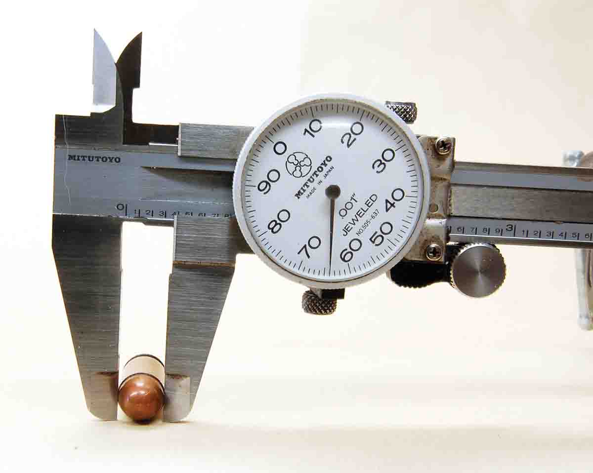 A dial caliper on a 9mm Makarov bullet showing that it is larger than the 9mm Luger.